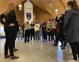  ?? PHOTO PROVIDED ?? The Alma College dance team is pictured March 8, huddled up inside its new, state-ofthe-art practice facility The Sanctuary.