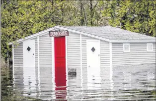  ?? VANESSA CLARK VIA CP ?? Floodwater­s are shown in Grand Lake, N.B. in a handout photo.