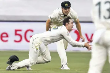  ?? (Photo: AFP) ?? Australia’s Travis Head drops a catch from Indian batsman Ajinkya Rahane as teammate Cameron Green looks on during the second day of the second cricket Test match between Australia and India at the MCG in Melbourne on Sunday.