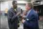  ?? DAVID WALLACE — THE ARIZONA REPUBLIC VIA AP, FILE ?? In this file photo, Phoenix Suns legend Connie Hawkins, left, talks with former Suns owner Jerry Colangelo before the Suns’ NBA basketball scrimmage in Phoenix. Basketball great Connie Hawkins has died at 75.