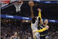  ?? BRANDON DILL — THE ASSOCIATED PRESS ?? Grizzlies forward Dillon Brooks (24) fouls Warriors guard Gary Payton II (0) during Game 2of a Western Conference playoff series at FedEx Forum on Tuesday in Memphis, Tenn.