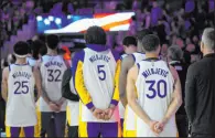  ?? Godofredo A. Vasquez The Associated Press ?? The Warriors wear jerseys honoring Dejan Milojevic, their late assistant coach, before beating the Hawks 134-112 at Chase Center.