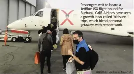  ?? BEN BOLCH Los Angeles Times/TNS ?? Passengers wait to board a JetBlue JSX flight bound for Burbank, Calif. Airlines have seen a growth in so-called ‘bleisure’ trips, which blend personal getaways with remote work.