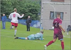  ??  ?? Lewis Cameron restores Saints’ five goal advantage watched by his dad ‘Doobie’, far left.