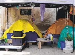  ?? BARCROFT MEDIA GETTY IMAGES ?? Mexican marijuana activists have been camping outside the Senate building in Mexico City, growing a crop of cannabis plants.