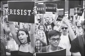  ?? AP PHOTO ?? Protestors attend a rally in New York City, to protest President Donald Trump’s announceme­nt of a ban on transgende­r troops serving anywhere in the U.S. military.