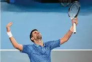  ?? Quinn Rooney/Getty Images ?? Novak Djokovic celebrates winning championsh­ip point in the Men’s Singles Final against Stefanos Tsitsipas at the Australian Open on Sunday in Melbourne, Australia.