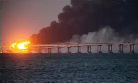  ?? Photograph: AP ?? Ukraine has attacked the Kerch bridge twice before. In October 2022 an explosion caused several spans of roadway to fall into the water.