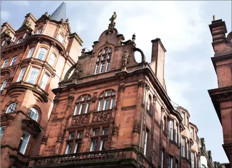  ?? ?? The red sandstone building has been described as Flemish Renaissanc­e or Franco-Flemish and it has many interestin­g details