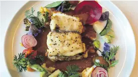  ?? PETER HUM ?? The red snapper at Xochi has a luxurious red chili sauce and vegetables.