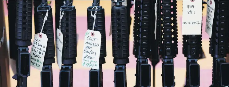  ?? DOMINICK REUTER/AFP/GETTY IMAGES FILES ?? The slick ads by major gun makers are typically big drivers of sales ahead of Black Friday. Gun-control activists are raising alarm over the potential of such ads to inspire the next shooter, while gun-rights advocates say the problem is deranged...