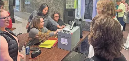  ?? ANNIE TODD/ARGUS LEADER ?? Minnehaha County election workers collect ballots from polling locations on June 7, 2022, in Sioux Falls.