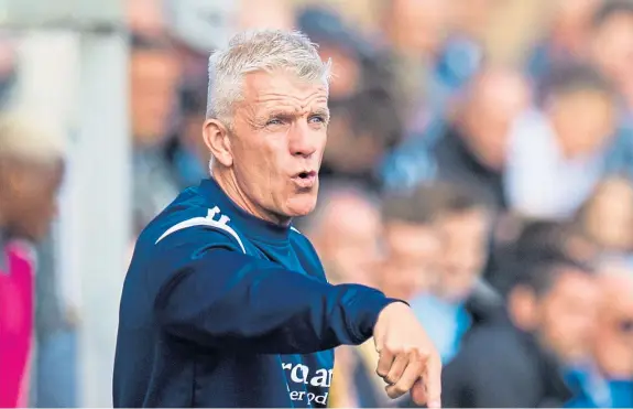  ??  ?? Forfar manager Jim Weir wants to thank an unknown Crieff man who came to the rescue after he and his assistant, Barry Sellars, were involved in a head-on collision on the M9 motorway on Monday night. He only knows his first name, Martin.