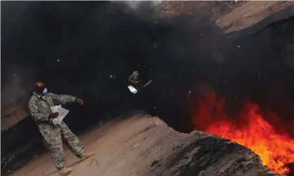  ?? ?? A burn pit at Balad airbase in Balad, Iraq, in March 2008. Photograph: Us Air Force/Reuters