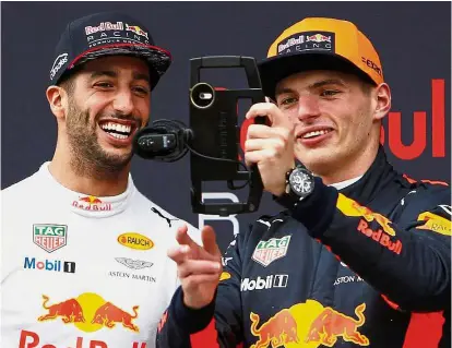  ??  ?? Redbull’s Max Verstappen (right) and Daniel Ricciardo posing for a wefie after the Malaysia Formula 1 Grand Prix race at Sepang on Sunday. — Reuters Picture-perfect pair: