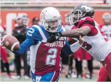  ?? DAVE SIDAWAY ?? Calgary Stampeders defensive lineman Ja’Gared Davis, right, specialize­s in giving opposing quarterbac­ks a hard time.