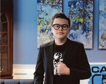  ?? H John Voorhees III/Hearst Connecticu­t Media ?? Caio “Ninja” Leaf, an 11-year-old content creator with autism and a popular YouTube personalit­y, announced the launch of his new project, the “Caio Talks” podcast, during World Autism Acceptance Week. Above, Caio in his home in Danbury.