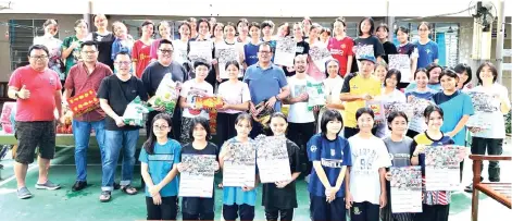  ?? ?? Joniston (second row, seventh right) witnessing the handing over of dry food to San Damiano Hostel Kiulu by a group of philanthro­pists, on Sunday.