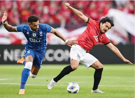 ?? AFP ?? Al-Hilal’s defender Ali Al-Bulaihi, left, is upbeat about his team’s Asian Champions League semifinals against Al-Ain, saying ‘we are not afraid of any team and we are ready for any challenge.’