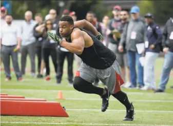  ?? Eric Risberg / Associated Press ?? Stanford defensive lineman Solomon Thomas, shown working out during Stanford’s pro day in March, is projected as a possible top-five selection, maybe even going to the 49ers at No. 2.