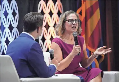  ?? MICHAEL CHOW/THE REPUBLIC ?? U.S. Sen. Kyrsten Sinema, D-Ariz., speaks Tuesday at the Arizona Chamber of Commerce and Industry update luncheon at the Arizona Biltmore in Phoenix. At left is chamber President and CEO Danny Seiden.