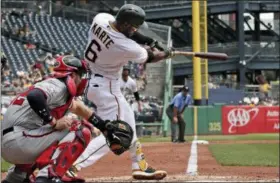  ?? GENE J. PUSKAR — ASSOCIATED PRESS ?? Pirates’ Starling Marte follows through on his two-run homer against the Nationals in the third inning of Wednesday’s game at Pittsburgh.