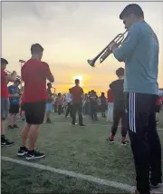  ?? Contribute­d photo ?? Rome High alum Alan Hester rehearses with the UGA Redcoat Band at Arcadia High School.