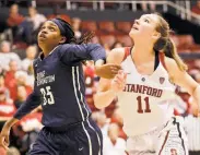  ?? Ben Margot / Associated Press ?? Stanford reserve Alanna Smith and George Washington’s Jonquel Jones vie for a rebound.