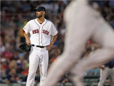  ?? MATT STONE / BOSTON HERALD ?? ROUGH START: Rick Porcello looks away after allowing a three-run homer to Austin Meadows during last night’s game between the Sox and Rays at Fenway Park.