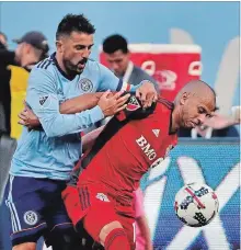  ?? ASSOCIATED PRESS FILE PHOTO ?? Jason Hernandez, right, may have played his last game for Toronto FC.