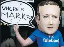  ?? — GETTY IMAGES ?? A protester wears a model head of Facebook CEO Mark Zuckerberg in London yesterday.