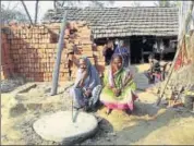  ?? HT PHOTO ?? Rahima Bewa (left) and her daughter Kamala sit in front of bricks bought to build a toilet at their home in Nowdapara.