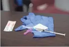  ?? AARON E. MARTINEZ/USA TODAY NETWORK ?? A COVID-19 vaccine kit awaits the next patient at an Emergence Health Network center in El Paso, Texas.