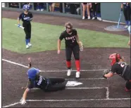  ?? (NWA Democrat-Gazette/Flip Putthoff) ?? Lauryn Heinle slides into home Saturday to score the lone run for Rogers on a wild pitch in a 2-1 loss to Cabot in the semifinals of the Class 6A softball state tournament at Rogers. More photos at arkansason­line.com/515girls6a/.