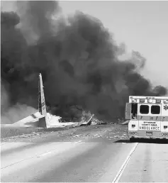  ?? — AFP photo ?? This file photo courtesy of the Savannah Internatio­nal Associatio­n Fire Fighters (IAFF Local 574) shows a US military C130 engulfed in flames and smoke down at 21 and Gulfstream Road, in Savannah, Georgia on May 2.