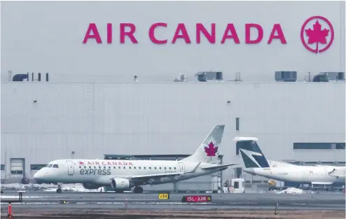  ?? PETER J THOMPSON / FINANCIAL POST ?? An Air Canada jet prepares for take off from Toronto’s Pearson Airport Wednesday. The airline, battered by nearly a
year of COVID-19 travel restrictio­ns, has reduced staff and is cutting flights to remote markets across Canada.