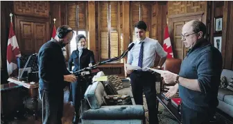  ??  ?? Prime Minister Justin Trudeau records “a quick, but very funny scene” for Corner Gas Animated with Brent Butt, the show’s creator, far right, and two sound technician­s.