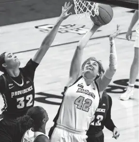  ?? DAVID BUTLER II / USA TODAY ?? Marquette’s Lauren Van Kleunen puts up a shot as Providence’s Alyssa Geary defends during the third quarter.