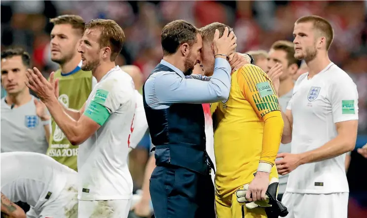  ?? AP ?? Gareth Southgate consoles England goalkeeper Jordan Pickford at the end of the World Cup semifinal loss Croatia in Moscow yesterday.