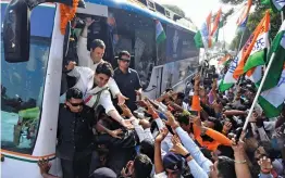  ?? — PTI ?? Congress chief Rahul Gandhi and party leader Jyotiradit­ya Scindia meet supporters at a roadshow in Bhopal on Monday.
