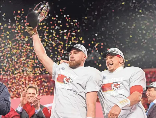  ?? JAY BIGGERSTAF­F/USA TODAY SPORTS ?? Kansas City Chiefs tight end Travis Kelce, left, and quarterbac­k Patrick Mahomes celebrate after winning the AFC Championsh­ip game against the Cincinnati Bengals at GEHA Field at Arrowhead Stadium.