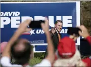  ?? BEN GRAY-ASSOCIATED PRESS ?? Sen. David Perdue, R-Ga., takes the stage before Vice President Mike Pence during a Defend the Majority Rally, Friday in Canton, Ga.