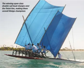  ??  ?? The winning open class double-sail boat charges over the finish line, making them overall Ninigo champions