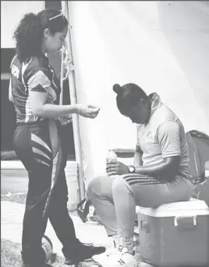  ?? ?? Jana Edghill advising a member of the Guyana women’s cricket team