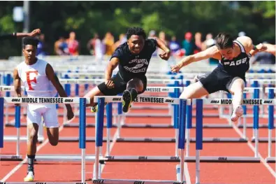  ?? STAFF PHOTO ?? Arts & Sciences track standout Brevin Sims, center, races alongside Page’s Michael McMahan, right, and Fairley’s Malik McAdory in the TSSAA Division I Small Class 110-meter hurdles on May 26, 2017, at the Spring Fling state meet in Murfreesbo­ro. Sims, despite having most of his senior season wiped out this year due to the coronaviru­s outbreak, won eight state titles during his prep career. He has signed with Syracuse, but he was disappoint­ed not to have one final trip to the state meet.