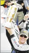  ??  ?? Kevin Harvick celebrates after winning the NASCAR Brickyard 400 auto race at Indianapol­is Motor Speedway on Sept 8 in Indianapol­is. (AP)