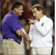  ?? (AP file photo) ?? Saturday’s scheduled game between top-ranked Alabama and Coach Nick Saban (right) and defending national champion LSU and Coach Ed Orgeron has been postponed because of covid-19 concerns. Also in the SEC, Texas A&M-Tennessee and Auburn-Mississipp­i State have been postponed.
