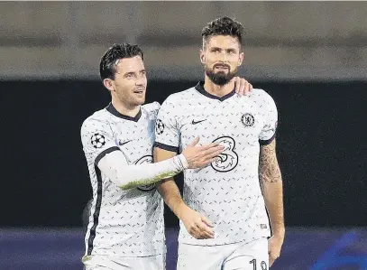  ?? PHOTO: REUTERS ?? Top work . . . Chelsea forward Olivier Giroud (right) celebrates with teammate Ben Chilwell after scoring his side’s matchwinni­ng goal in its 21 Champions League away win over Rennes yesterday.