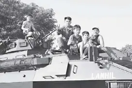  ??  ?? Soldiers take time with kids who were much interested in examining the tanks and other army displays.