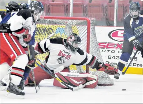  ?? JOEY SMITH  TRURO DAILY NEWS ?? Truro Bearcats goaltender Jaxon Maloney reaches to cover the puck during action Friday against the Bedford Blues at the Nova Scotia midget AA hockey championsh­ip in Truro. The Bearcats lost the contest 6- 3.